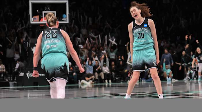 New York Liberty forward Breanna Stewart celebrates with Courtney Vandersloot after scoring against the Connecticut Sun during the WNBA playoffs.